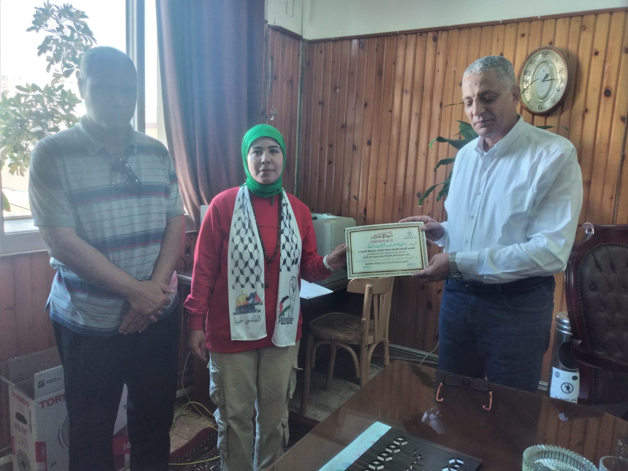 Today, Professor Dr. Essam Abdel Hafez Boodi, Dean of the College, honored the student Nisreen Ghoneim, who won first place at the university level in the Classical Poetry Cultural Festival. He also honored the student Abdel Rahman Saeed Al-Faramawy in the athletics competition for people of determination, first discus - third 100 meters. He honored Mr. Sami Badr, Director of the Youth Welfare Department, and Ms. Heba Abdel Rahman, the Cultural Activity Officer.